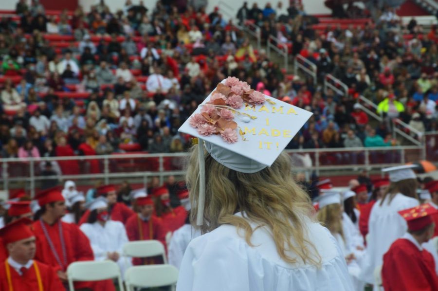 A new graduate leaves the stage after accepting her diploma on May 29, 2021 at Stadium Field.