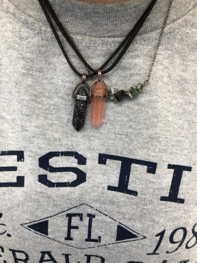 Obsidian+and+strawberry+quartz+crystals%2C+worn+around++a+students+neck.