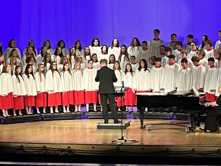 A+Cappella+Choir+performs+on+stage+at+the+WorldStrides+Heritage+Festival%2C+lead+by+choir+director+Joshua+Dubs.