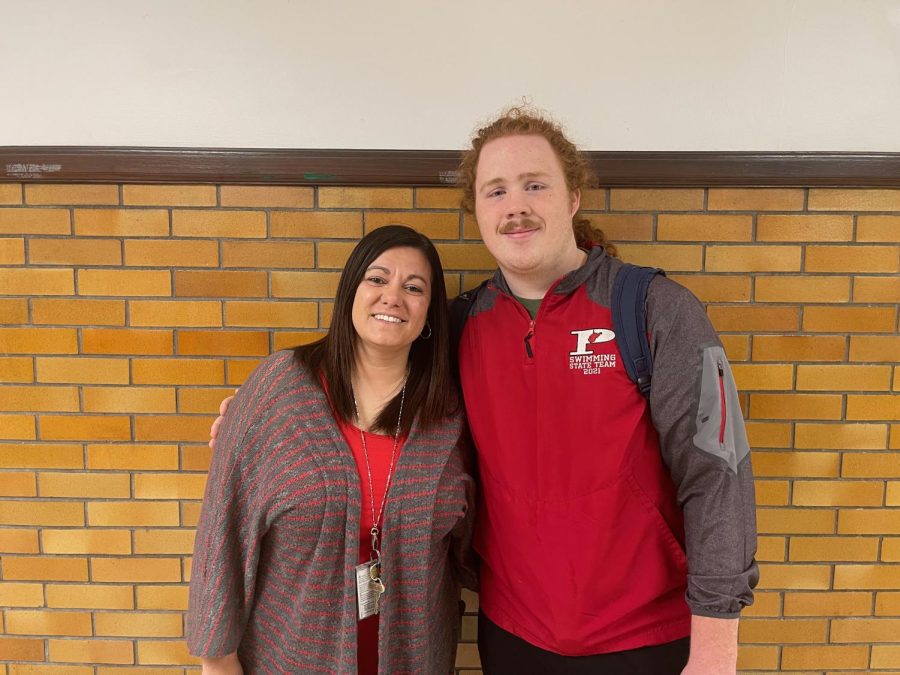 Senior Lucian Baumgartner stands with his favorite teacher Jennifer Fleshman who teaches math. Shes really nice and funny, and we kind of egg each other on, said Baumgartner. Shell make fun of my pencils a lot, and Ill make fun of the fact that she doesnt grade stuff in a very timely manner. But shes been a really fun teacher to have, and I think I was blessed to have her for two classes.