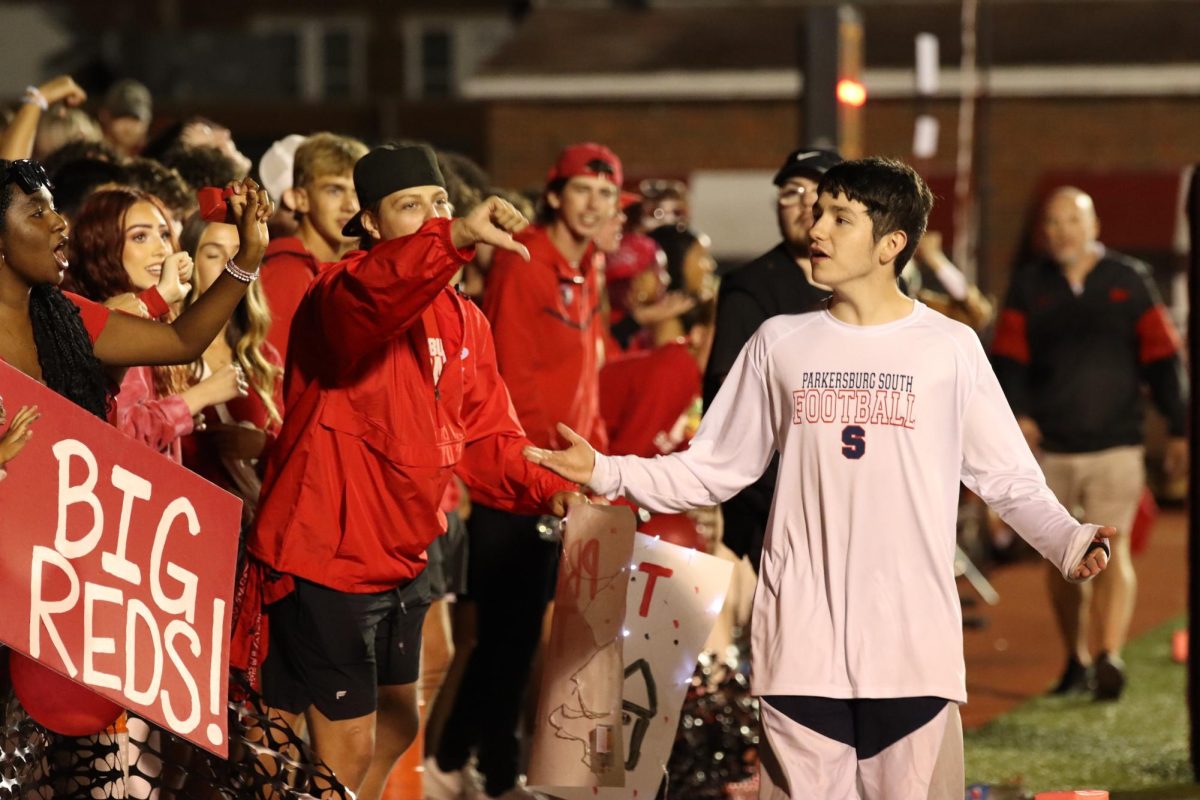 Parkersburg South student Caden Pollinsky being booed while walking by the PHS student section on Sept. 15 at Stadium Field. 