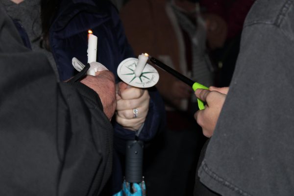 Two candles being lit during the annual tree lighting ceremony on Dec 5.