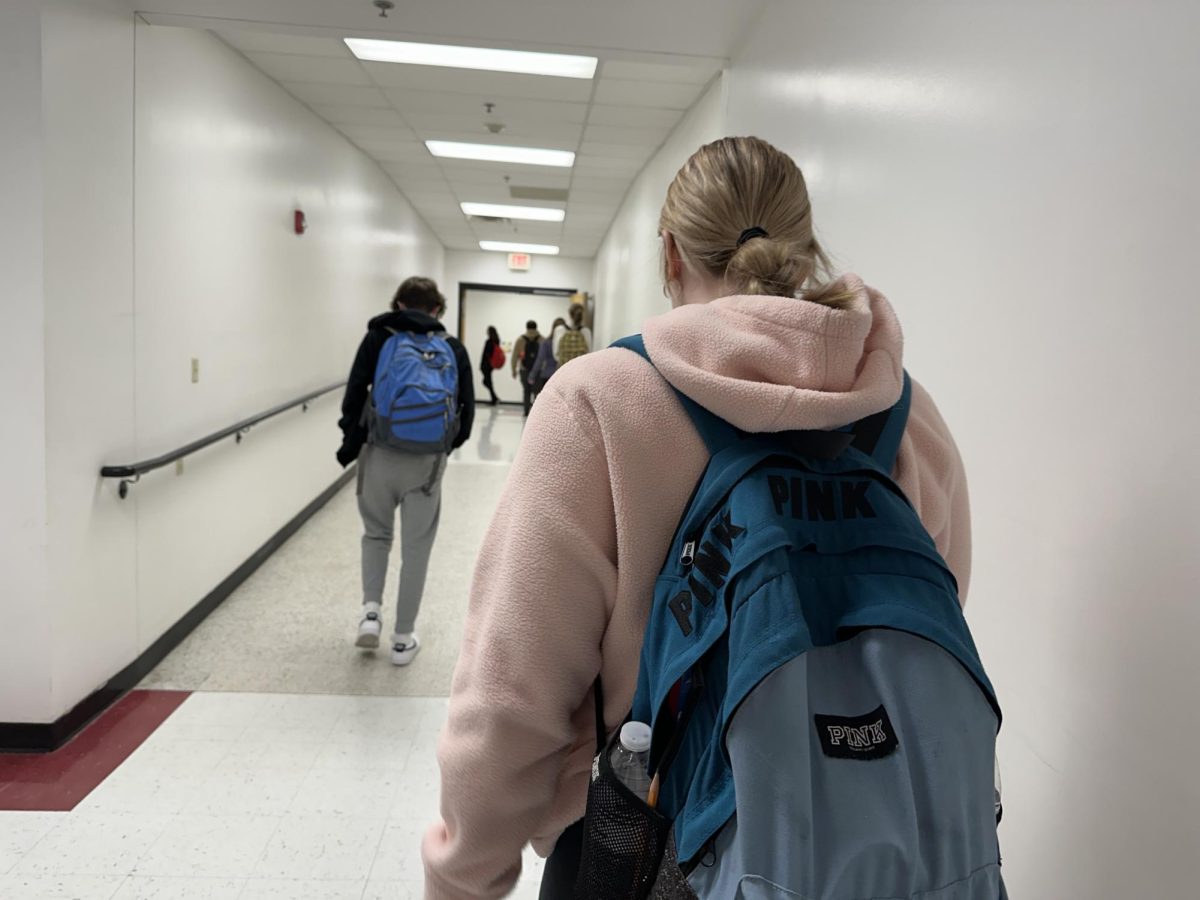 Students walk in second floor science wing with their backpacks on Jan 5.