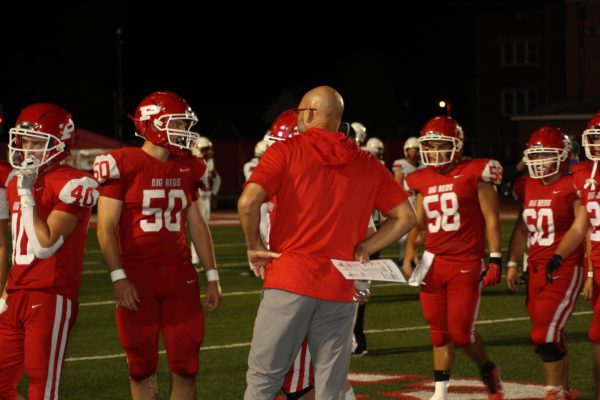 Players on the sidelines Aug. 30 at Stadium Field.