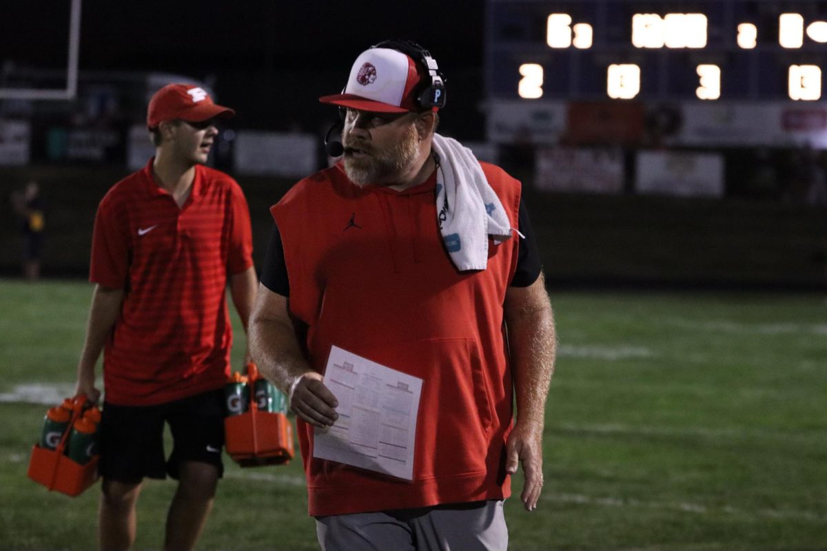 Head Coach Matt Kimes walks back to the sideline after a time out.