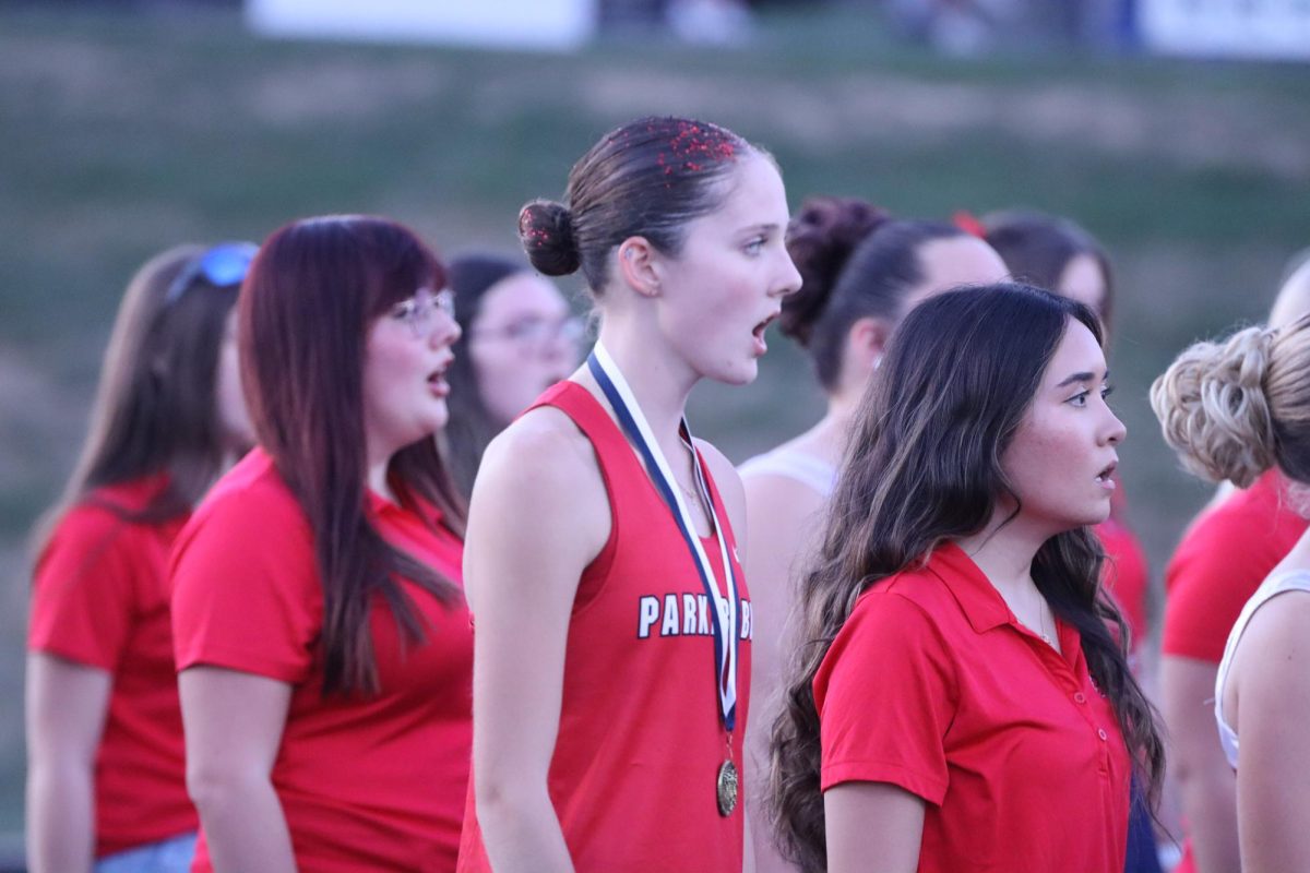 Seniors Katie Rutherford and Danica Sheppard sing with the A Cappella Choir.