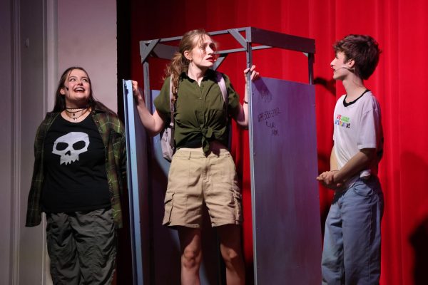 Grace Miller, Daphne Cockerham and Zach Gaston rehearse for “Mean Girls” April 22 in the auditorium.