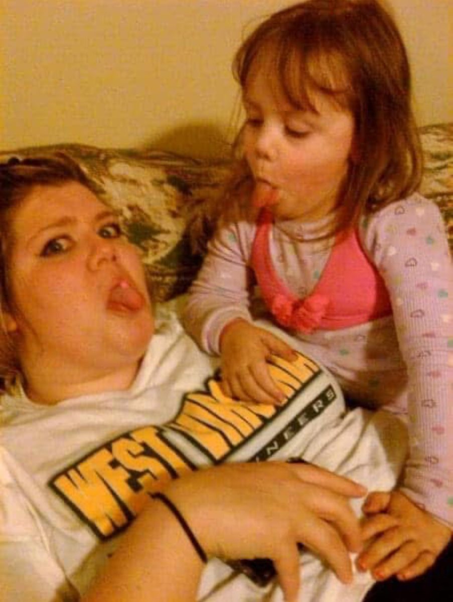 Writer Aubrie Kendall sticking out her tongue at her mother, Ashley McDermott.