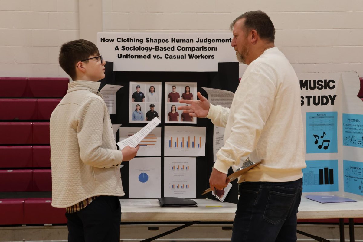 Freshman Ford Alston begins his science fair presentation Dec. 3 in the Jack Stephens Gym. 