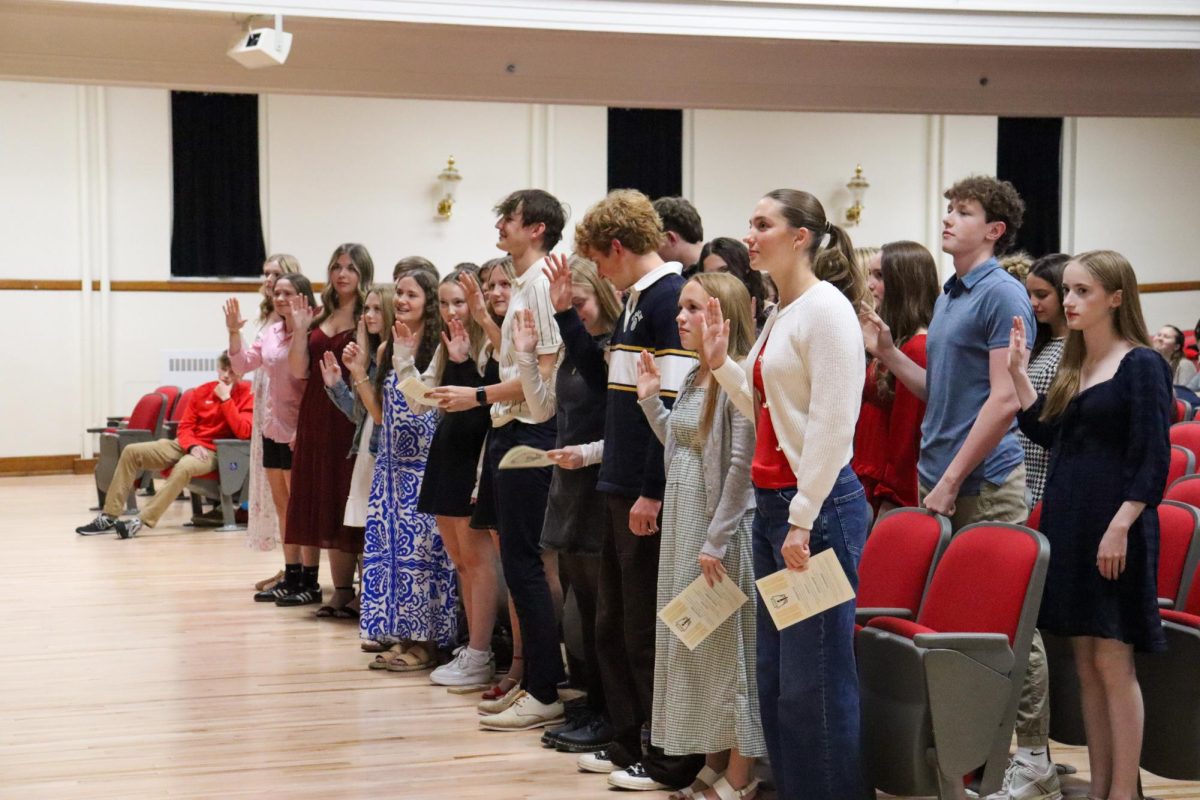 Inductees recite the National Honor Society Pledge Nov. 18 in the auditorium.