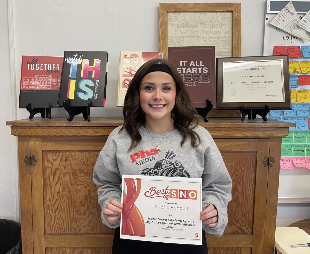 Senior Aubrie Kendall with her Best of SNO certificate.