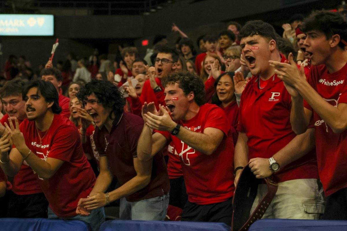 Seniors Will Hopkins, Jay Bowling, Landen Deuley, Parker Slattery and Jack McLean cheer in the student section March 14.