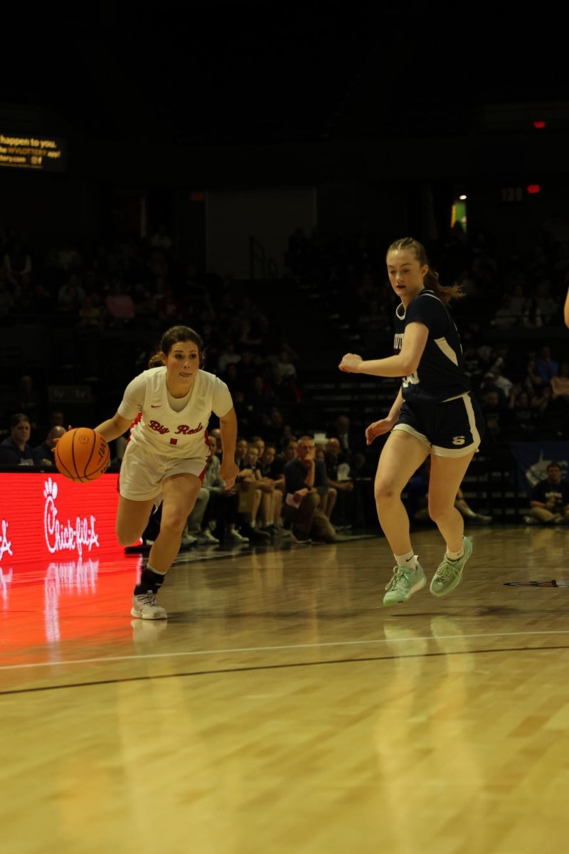 Senior Lauren Flanagan makes a move towards the hoop March 14.