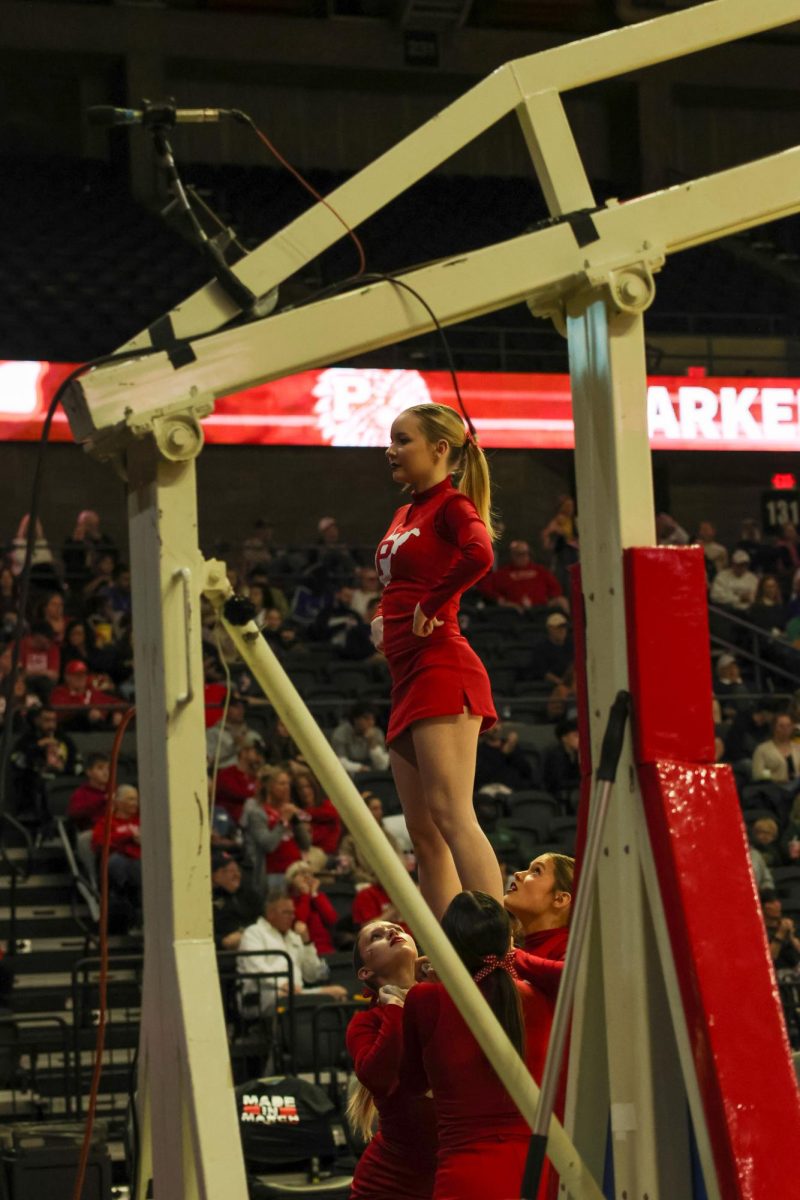 Sophomore cheerleader Samantha Mauzy in a stunt March 14. 