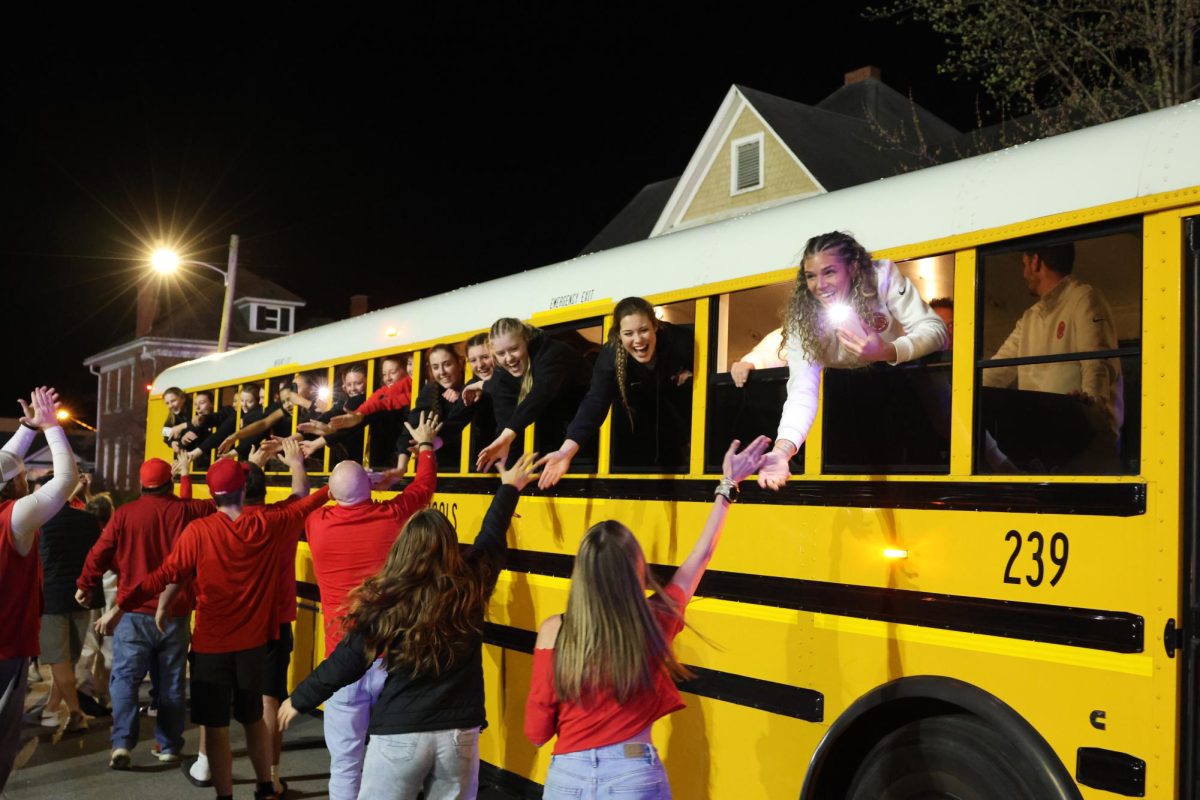 Students and parents welcome back the girls basketball team to the Fieldhouse March 14.