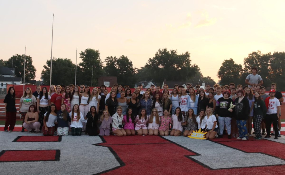 Members of the 2026 senior class pose for a group picture during senior sunrise Aug. 23 at Stadium Field.