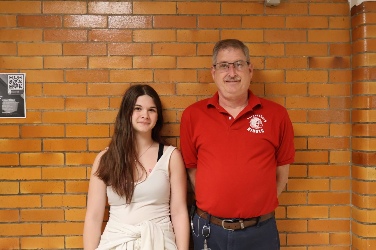Junior Gemma Davies with her favorite teacher, Glenn Rickard. "Chief's always been someone you can talk to without having to worry about him judging you, and anytime you needed anything he was always there for you," Davies said. 