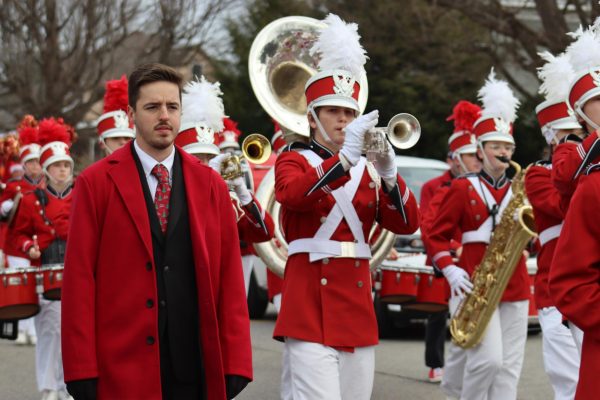 Assistant band director Nic McVaney walks with the band during the Vienna Christmas parade on Grand Central Ave. Dec. 6.