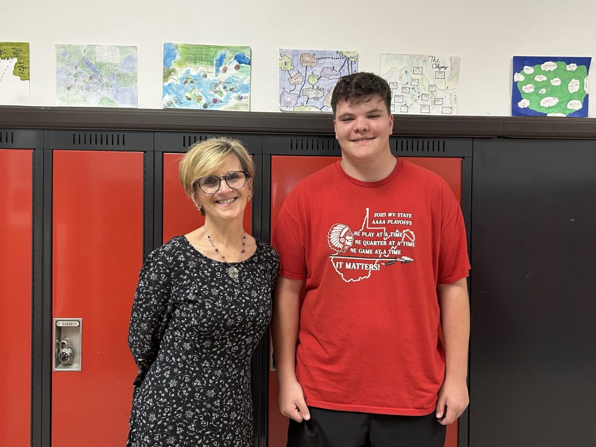 Freshman Ben Eakins with his favorite teacher, Sandy Butcher. "Mrs. Butcher is so caring to her students and she always gives her students good incentives to learn and do good in her class, especially with Jolly Ranchers," Eakins said.