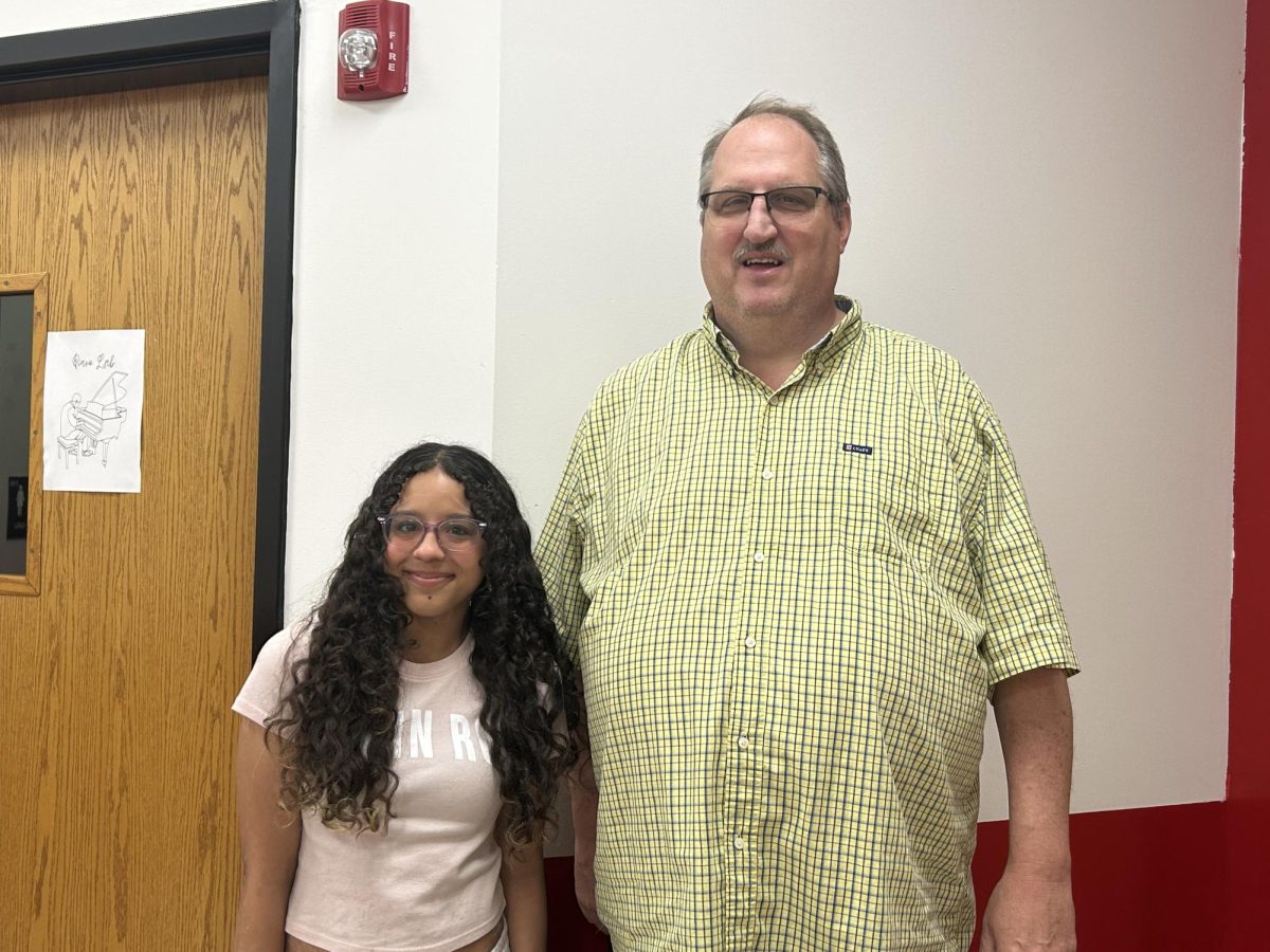 Freshman Leighann Murphy with her favorite teacher, Dan White. "Mr. White is my favorite teacher because he encourages his students to do a lot of things and he pushes their boundaries," Murphy said.