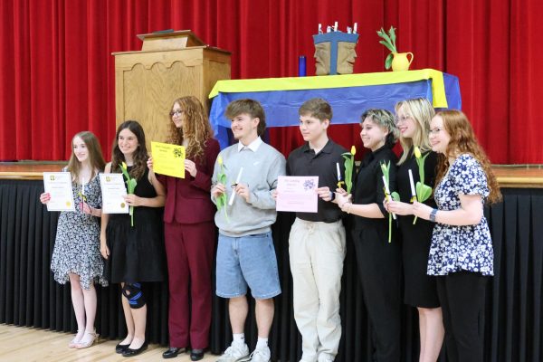 The new Thespian inductees pose for a picture during Thespian inductions in the auditorium May 15. 