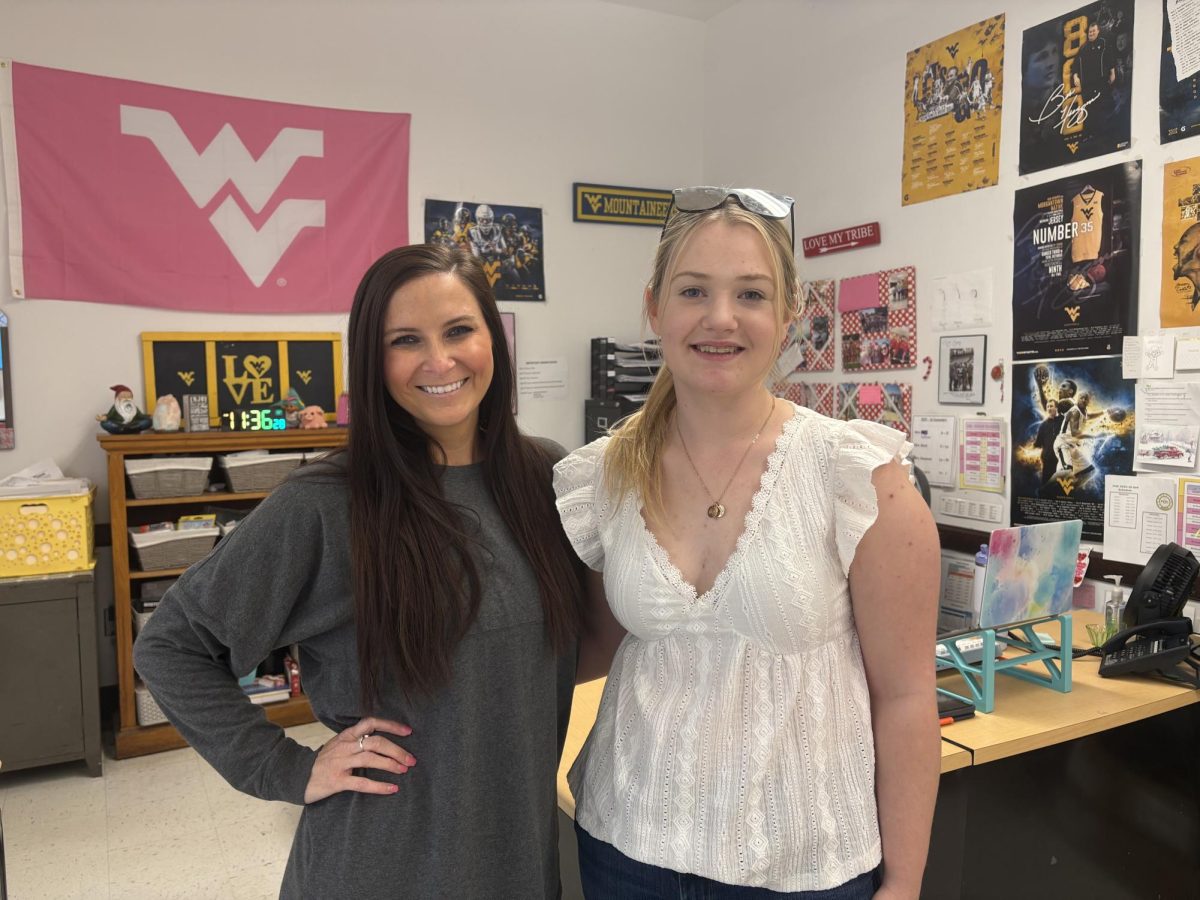 Senior Hannah Biles with her favorite teacher, Amy Burns. "Ms. Burns is my favorite teacher because through my high school experience, anytime I needed someone to go to, to talk to or I need help with my work, she was there for me," Biles said.