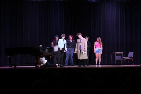 Members of the Drama Club act in "Strung Along" during the Thespian Showcase in the auditorium May 13. "Strung Along" is a one-act student-written play by seniors Derek Roberts and Payton Johnson.